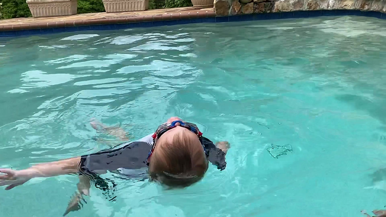 Two year old swim float swim.